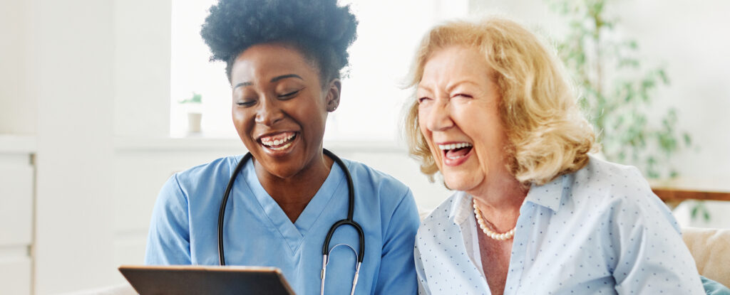 nurse laughing with patient as patient advocate